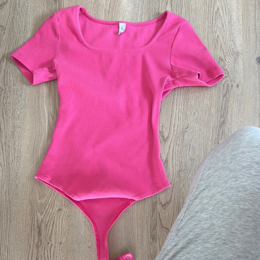 Pink One Piece Bodysuit with Short Sleeves and Scoop Neckline